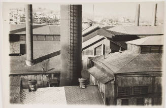 Untitled (factory buildings with stacks in foreground and background)