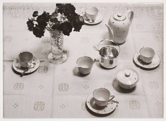 Untitled (coffee service with vase of flowers)