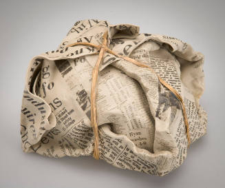 Newspaper-wrapped Package with Gold String