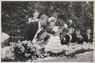John F Kennedy and Jackie Pose beside their Wedding Cake