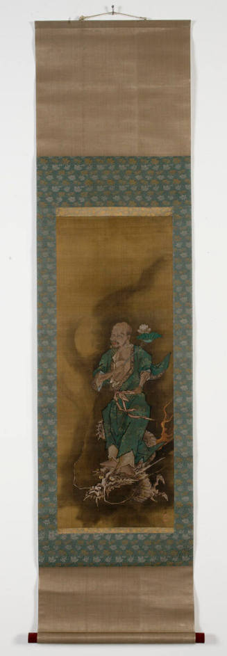 Sennin or Buddhist figure holding lotus riding a dragon