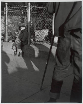 Cambridge, Massachusetts (Boy Sitting Against Fence)