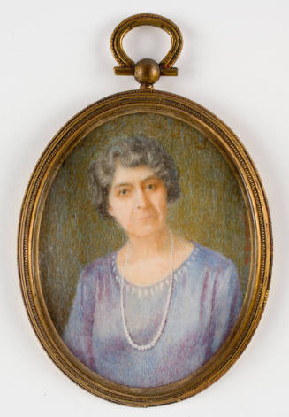Portrait of woman with gray hair and long pearls