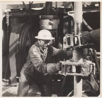 Royalite Drilling Crew Breaking a Joint on a Drill Pipe, Black Diamond, Turner Valley Drill Fields, Alberta, Canada