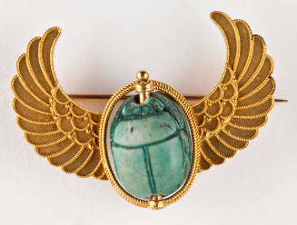 Brooch featuring an Ancient Scarab in a Modern Winged Mount